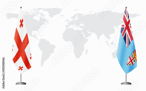 Georgia and Fiji flags for official meeting against background of world map.