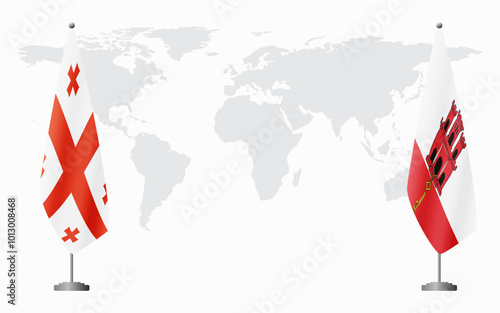 Georgia and Gibraltar flags for official meeting against background of world map.