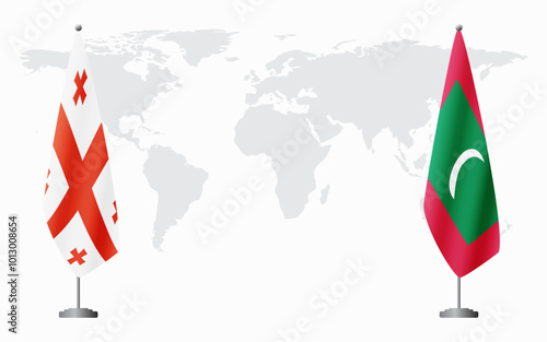 Georgia and Maldives flags for official meeting against background of world map.