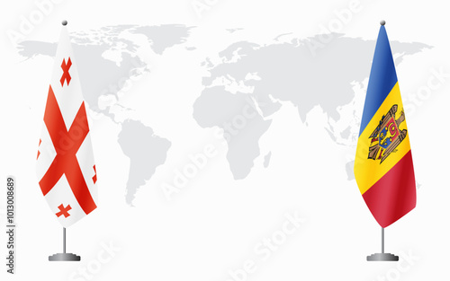 Georgia and Moldova flags for official meeting against background of world map.