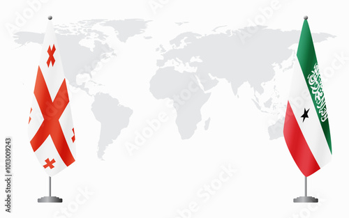 Georgia and Somaliland flags for official meeting against background of world map.