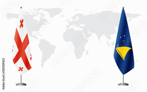Georgia and Tokelau flags for official meeting against background of world map.