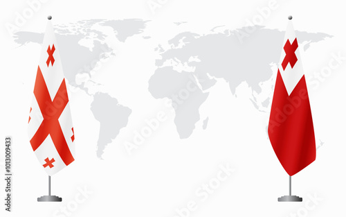 Georgia and Tonga flags for official meeting against background of world map.