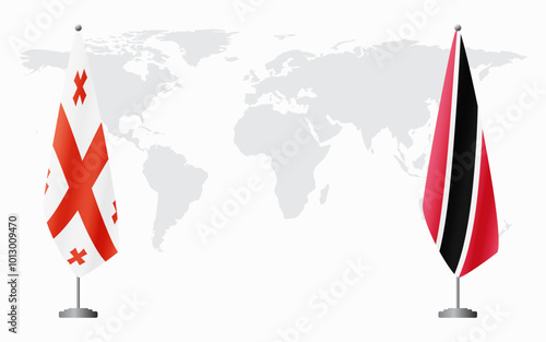 Georgia and Trinidad and Tobago flags for official meeting against background of world map.