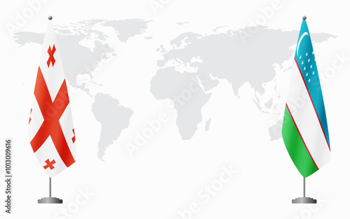 Georgia and Uzbekistan flags for official meeting against background of world map.