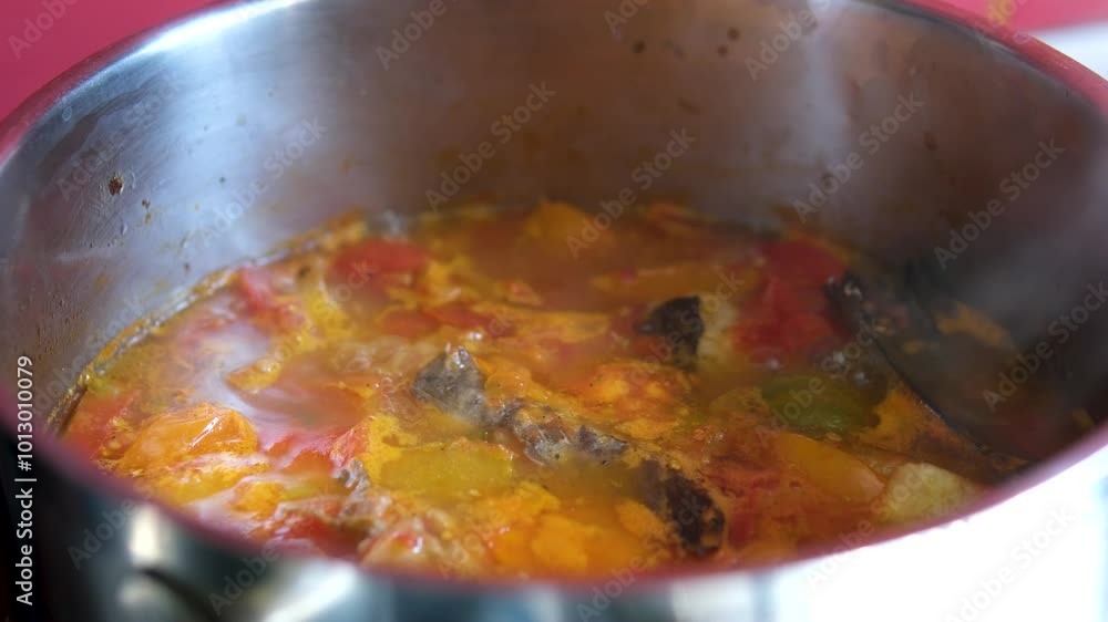 asian recipe fish with tomatoes popular in vietnam soup. fry pieces of fish stew with tomatoes in its own juice asian recipe fish with tomatoes popular in vietnam soup. fry pieces of fish stew with tomatoes in its own juice