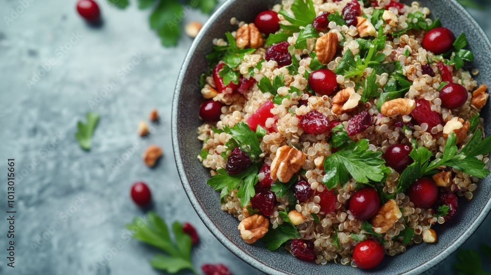 Quinoa salad with cranberries, top-down view, white tone background, garnished with nuts, fresh and clean composition. Quinoa salad with cranberries, top-down view, white tone background, garnished with nuts, fresh and clean composition.