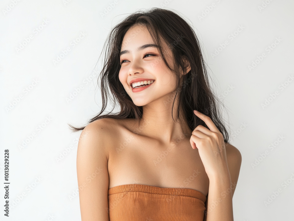 beautiful young woman with long hair is smiling joyfully while wearing tube top, showcasing her radiant personality and confidence. Her expression reflects happiness and warmth beautiful young woman with long hair is smiling joyfully while wearing tube top, showcasing her radiant personality and confidence. Her expression reflects happiness and warmth