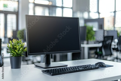 Minimalist white desk with a computer and office background, blurred business center interior in the blurred background. Mockup for design or presentation