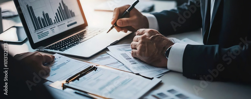 Business meeting with data analysis and hands on documents.