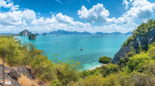 A panoramic view of the beautiful coastline of Phang Nga, with clear blue waters and lush tropical vegetation.