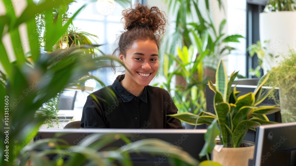A receptionist working in a bright, airy office, smiling as they look at the computer screen, with potted plants in the background A receptionist working in a bright, airy office, smiling as they look at the computer screen, with potted plants in the background