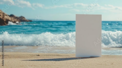 A blank canvas stands on the beach, surrounded by gentle waves and scenic coastal beauty, perfect for creative projects.