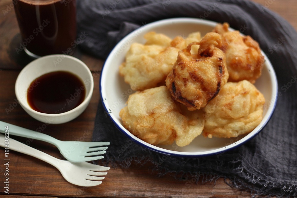 Fried Tape or Tape Goreng, Indonesian Traditional Snack Made from Fermented Cassava. Tape Goreng is Classic Indonesian Cuisine. Fried Tape or Tape Goreng, Indonesian Traditional Snack Made from Fermented Cassava. Tape Goreng is Classic Indonesian Cuisine.