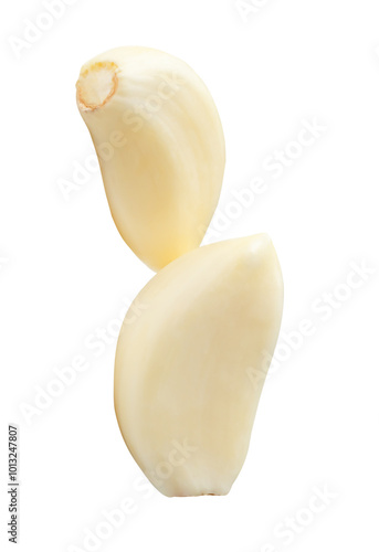 Peeled garlic cloves in stack isolated on white background with clipping path