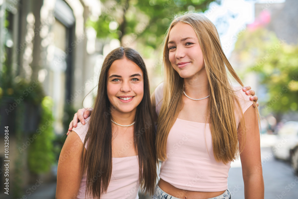 Best friends teen girl embracing each other with smiling Best friends teen girl embracing each other with smiling