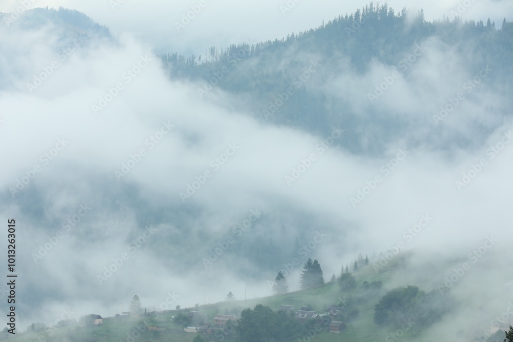 Picturesque view of beautiful mountains covered with fog Picturesque view of beautiful mountains covered with fog