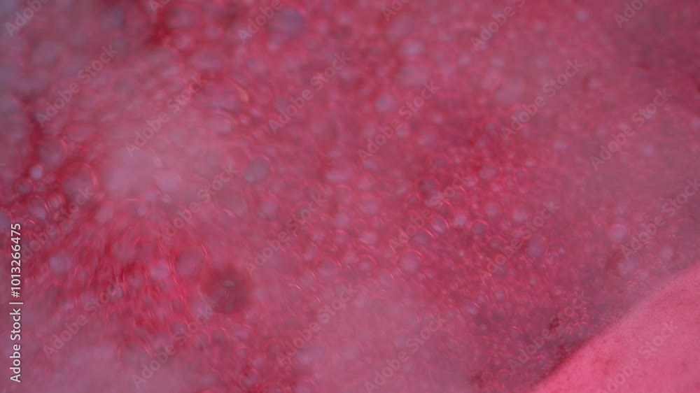 Pink foam for red currant jam. red currant are boiled in a pot with sugar. The most delicious homemade red currant jam.