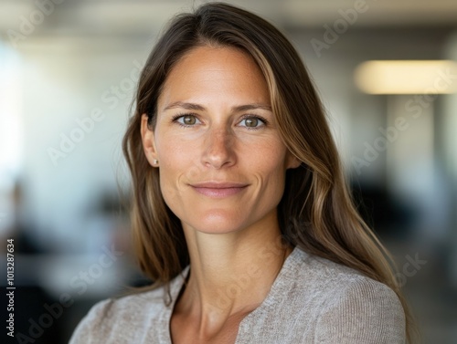 Wallpaper Mural Confident woman smiling while standing in a modern office setting Torontodigital.ca
