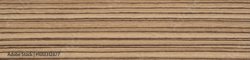 Natural Zebrano veneer showcases rich brown hues with distinctive dark streaks, adding a touch of organic elegance