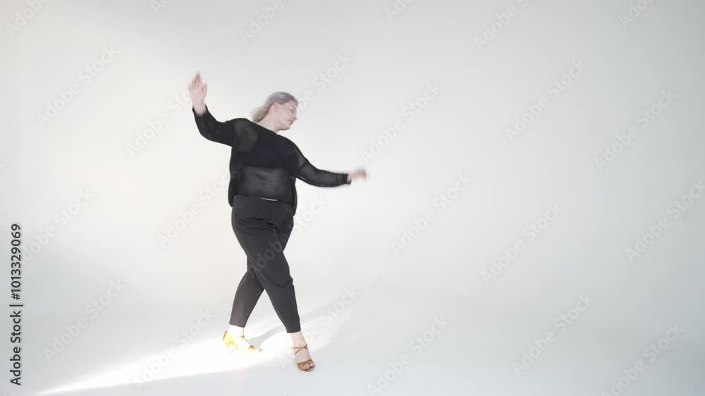 Dynamic Dance Movement in a Studio Setting Enveloped by Bright, Invigorating Lighting Dynamic Dance Movement in a Studio Setting Enveloped by Bright, Invigorating Lighting
