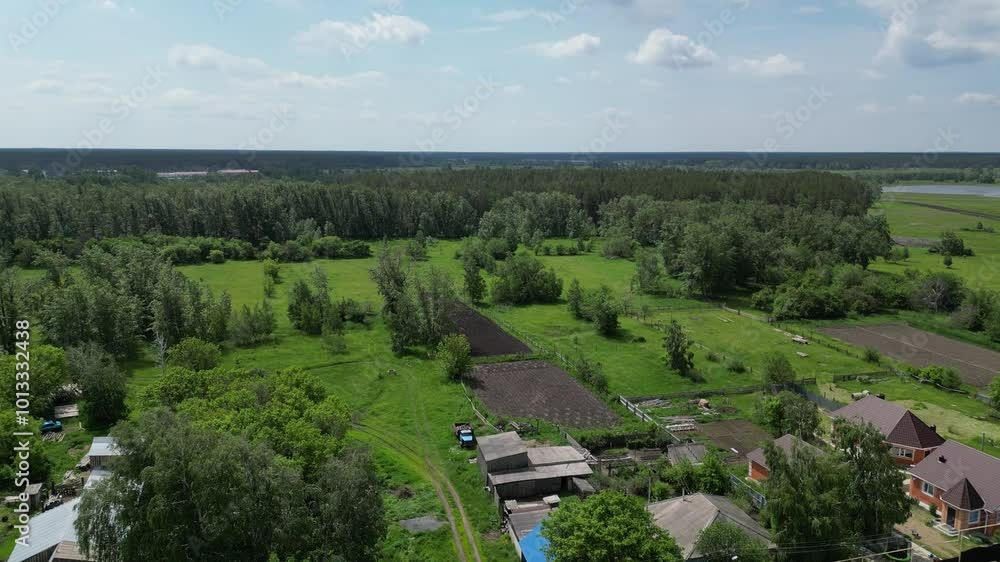 Village. The view from the drone. Houses and farmland. Village. The view from the drone. Houses and farmland.