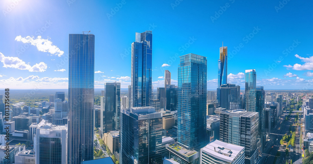 Obraz premium Aerial View of City Skyline and Skyscrapers Under Blue Sky and White Clouds