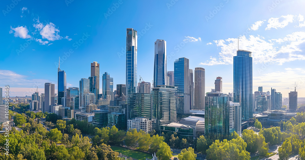 Obraz premium Aerial View of City Skyline and Skyscrapers Under Blue Sky and White Clouds