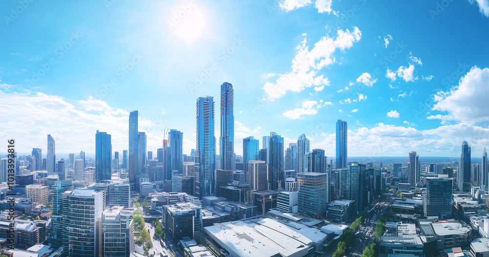 Fototapeta premium Aerial View of City Skyline and Skyscrapers Under Blue Sky and White Clouds