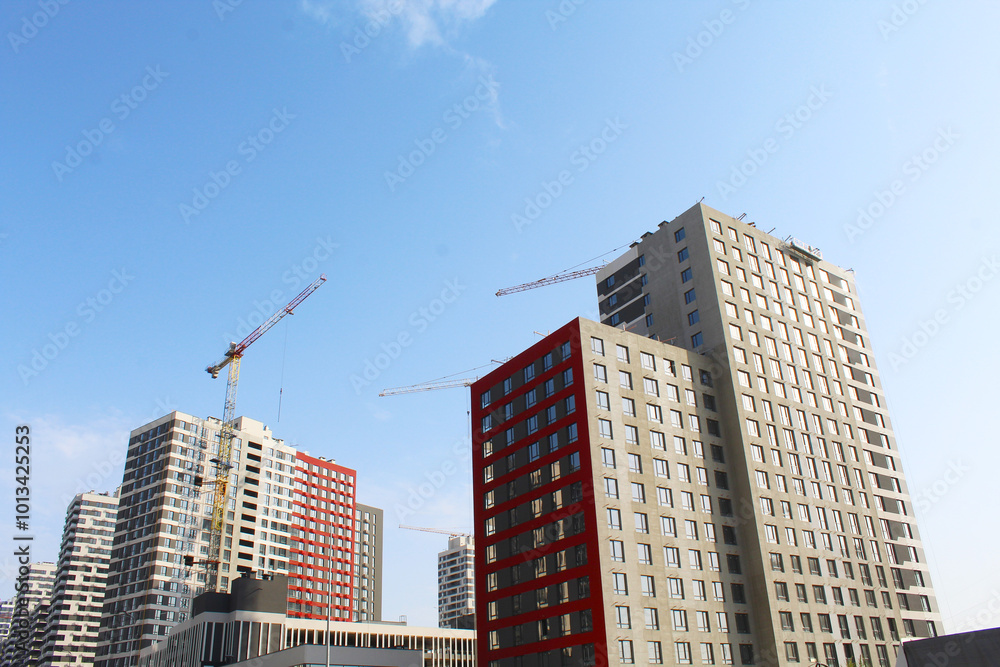 Fototapeta premium building under construction, construction site with cranes