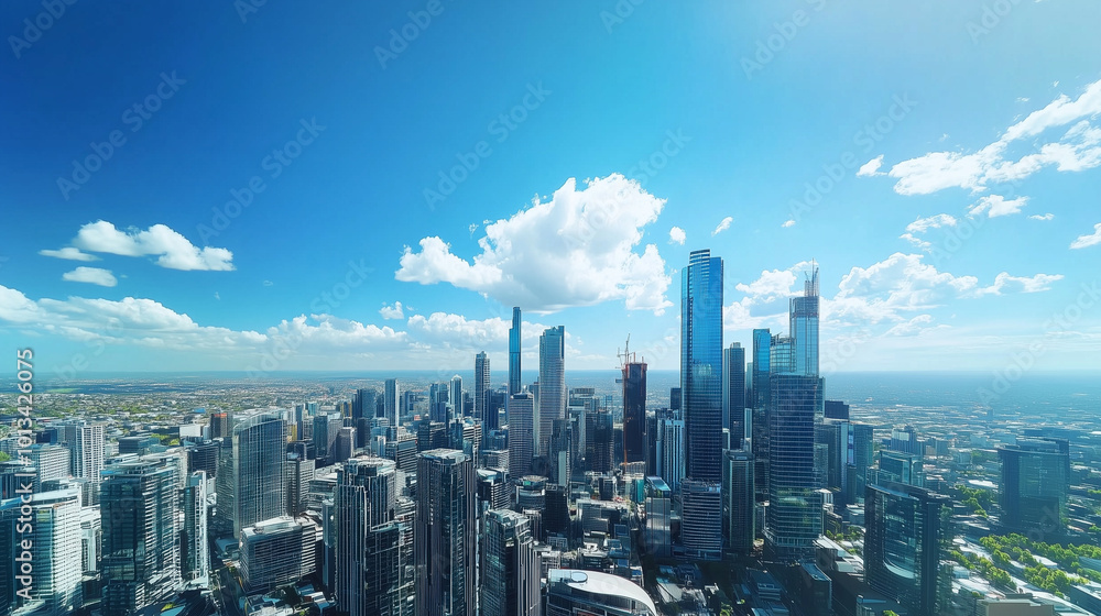 Obraz premium City Skyline and Skyscrapers Under Blue Sky and White Clouds Aerial View