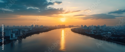 Breathtaking Sunset Over Urban Skyline Reflected in Serene River Waters