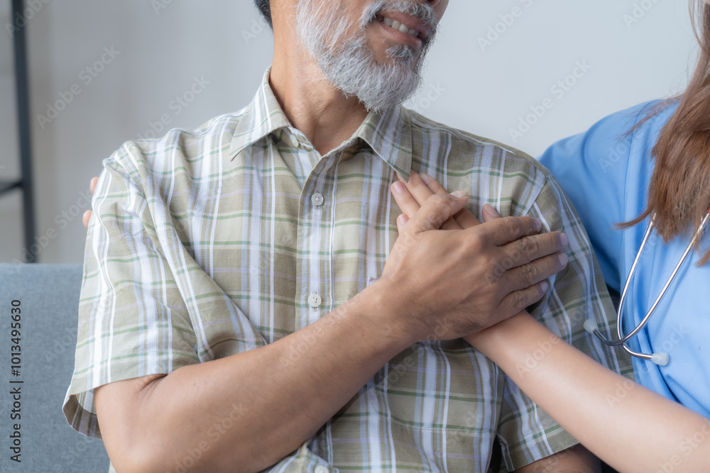 Nurse is holding the hand of an elderly man who is experiencing discomfort in his chest, offering reassurance and support Nurse is holding the hand of an elderly man who is experiencing discomfort in his chest, offering reassurance and support