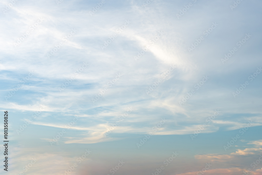 Beautiful blue sky with fluffy white clouds, a breathtaking sunset painting the sky in vibrant hues Beautiful blue sky with fluffy white clouds, a breathtaking sunset painting the sky in vibrant hues