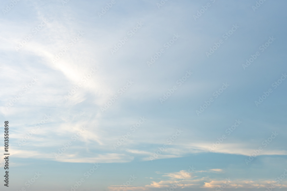 Beautiful cloudscape painted in hues of blue and white, casting long shadows on the vast ocean as the sun dips below the horizon Beautiful cloudscape painted in hues of blue and white, casting long shadows on the vast ocean as the sun dips below the horizon