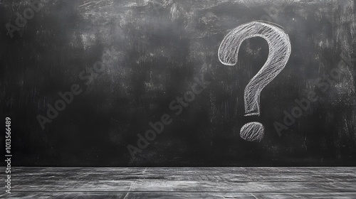 A chalk-drawn question mark on a blackboard highlights themes of curiosity and uncertainty, presented in a minimalist black-and-white style with dramatic lighting. photo