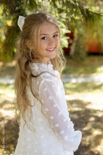 a young girl wearing a white bow and a bow on her head