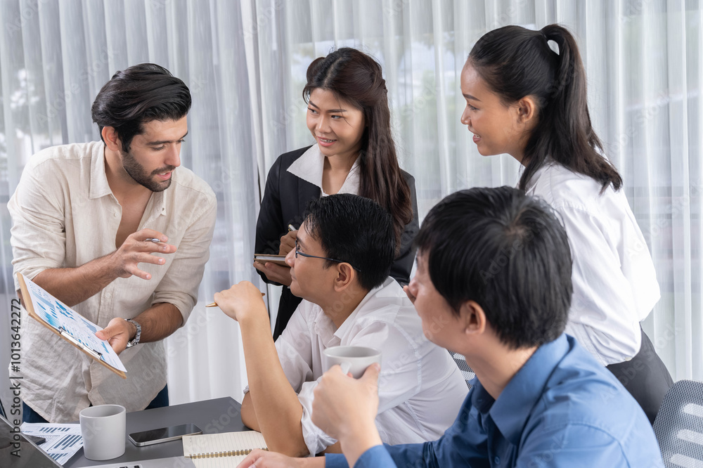 Group of diverse office worker employee working together on strategic business marketing planning in corporate office room. Positive teamwork in business workplace concept. Prudent Group of diverse office worker employee working together on strategic business marketing planning in corporate office room. Positive teamwork in business workplace concept. Prudent