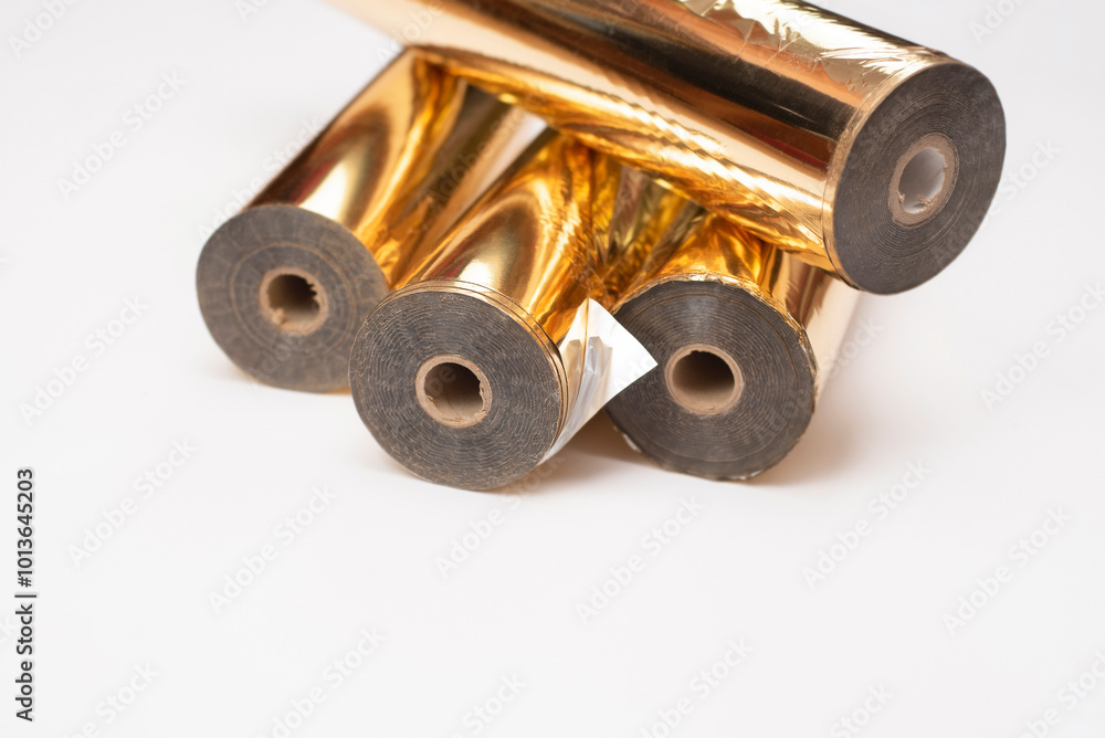 Rolls of gold foil for embossing advertising products, labels, book covers through the use of a metal cliche and a thermopress Rolls of gold foil for embossing advertising products, labels, book covers through the use of a metal cliche and a thermopress