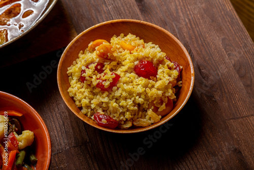 Bulgur with dried fruits on the festive table for the meal on Rosh Hashanah