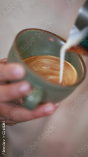 Vertical footage of Coffee Barista slow motion Art of Coffee. Drinking roasted black coffee in the morning