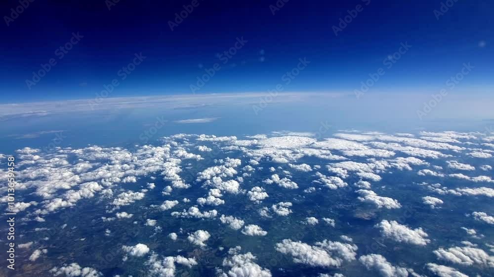 A breathtaking view of the clouds painting the horizon above vibrant landscapes during midday flight A breathtaking view of the clouds painting the horizon above vibrant landscapes during midday flight
