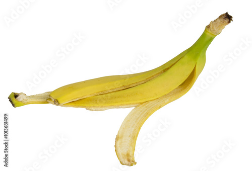 Single banana peel is lying on a white background