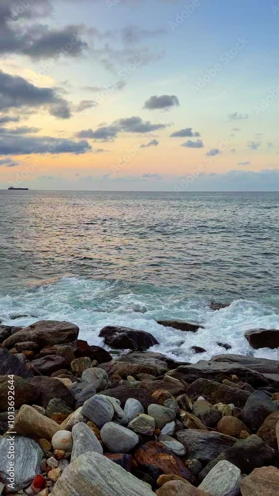 Slow motion of waves breaking on the rocks on a tropical beach at sunset. Macuto Coast, Venezuela. Slow motion of waves breaking on the rocks on a tropical beach at sunset. Macuto Coast, Venezuela.