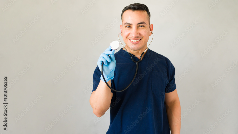 Attractive hispanic doctor posing with a stethoscope and smiling in a professional setting Attractive hispanic doctor posing with a stethoscope and smiling in a professional setting