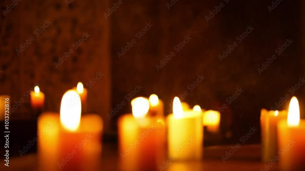 A sudden gust of wind blowing out candles in a dark room. A sudden gust of wind blowing out candles in a dark room.