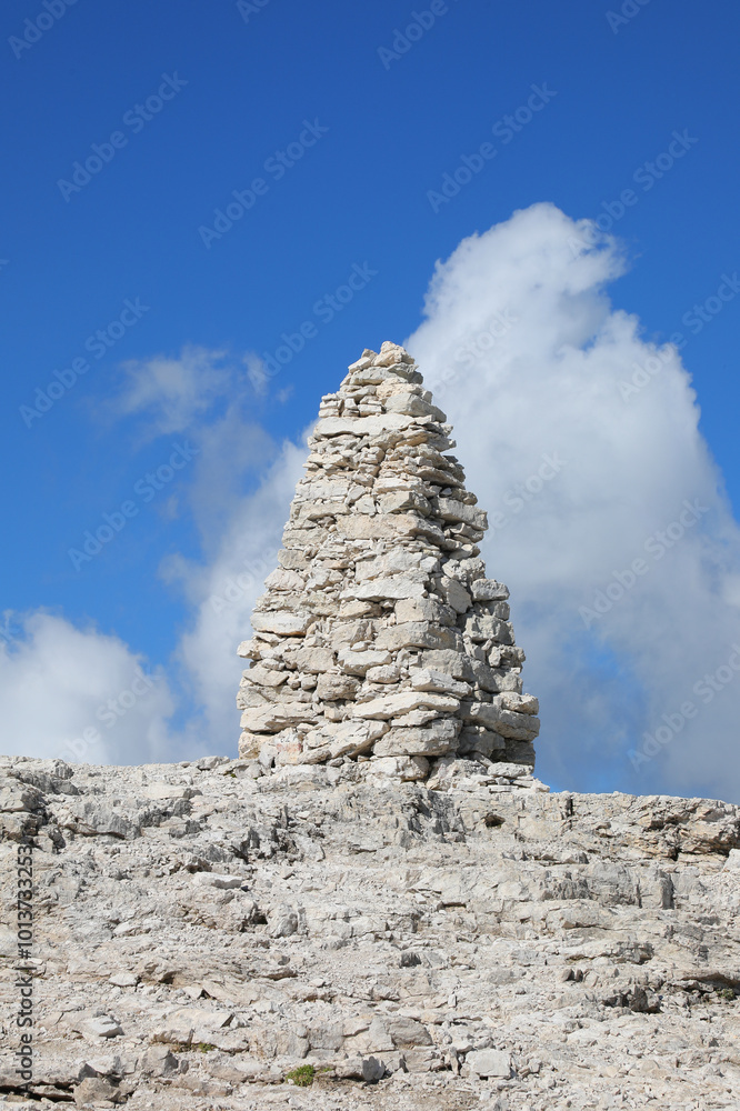 very big pile of stones known as a cairn in the mountains symbolizing either a prayer or a wayfinding marker in the European Alps very big pile of stones known as a cairn in the mountains symbolizing either a prayer or a wayfinding marker in the European Alps