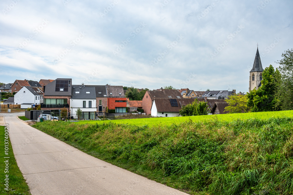 Concrete country road through the Flemish fields of Brussegem, Merchtem, Belgium, SEP 29, 2024 Concrete country road through the Flemish fields of Brussegem, Merchtem, Belgium, SEP 29, 2024