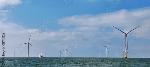 Fotografía Voilier navigant entre les éoliennes offshore du parc éolien en mer de Saint-Naz