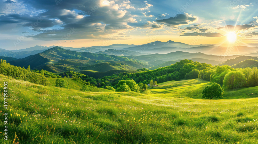 Fototapeta premium A breathtaking view of a rolling green valley with distant mountains under a sky filled with soft clouds